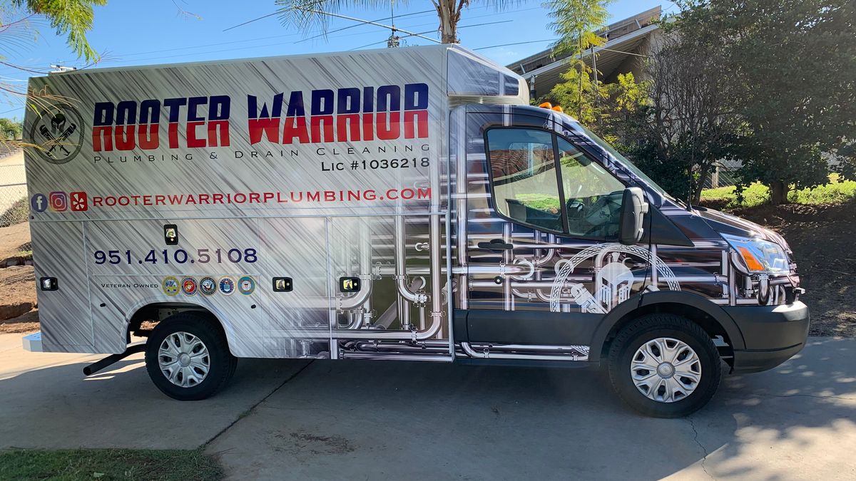 Rooter Warrior Plumbing service truck, side view